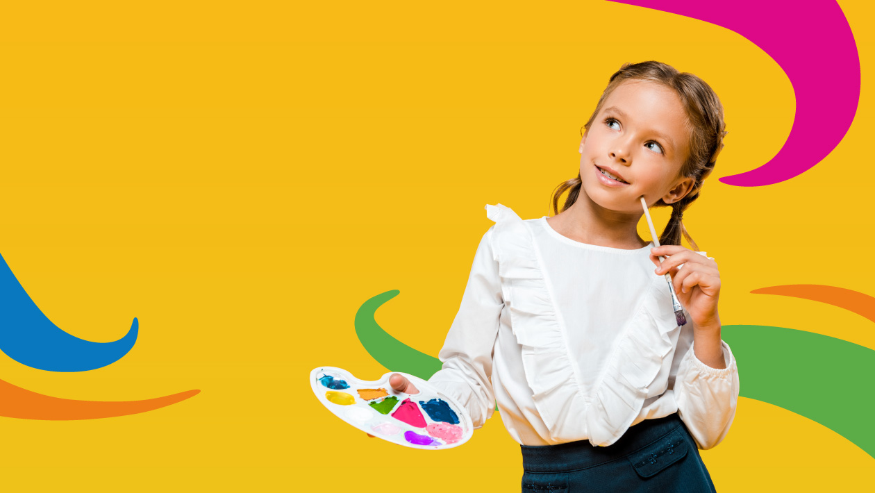 Girl in white shirt holding a paint palette with multi coloured paint and a paint brush